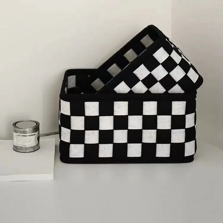 Checkerboard patterned grey felt storage basket with folded sides, shown with dimensions 37cm by 29cm by 19.5cm.
