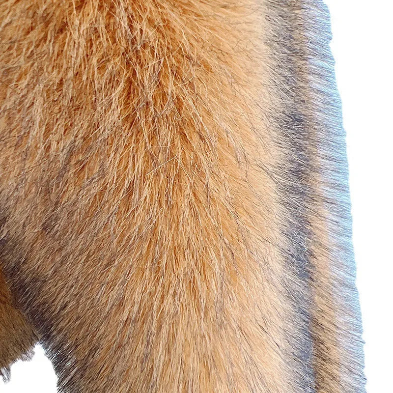A woman wearing a silver grey loose-fit mid-length artificial fur coat.