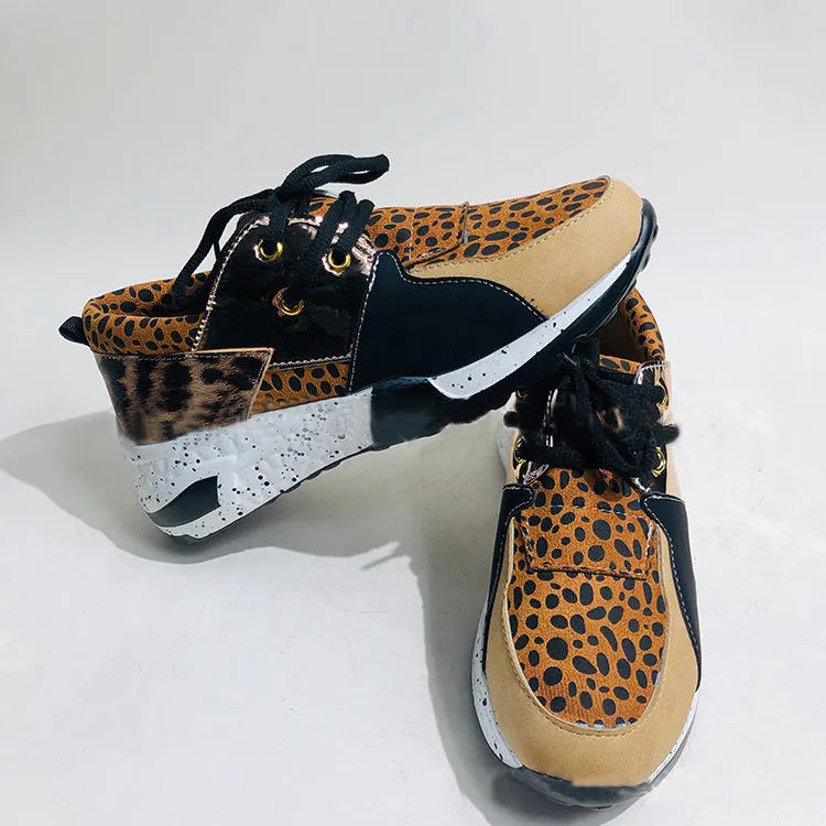 Women's casual suede sneakers with a wedge heel in black, leopard, pink, panther, and snake pattern colours.