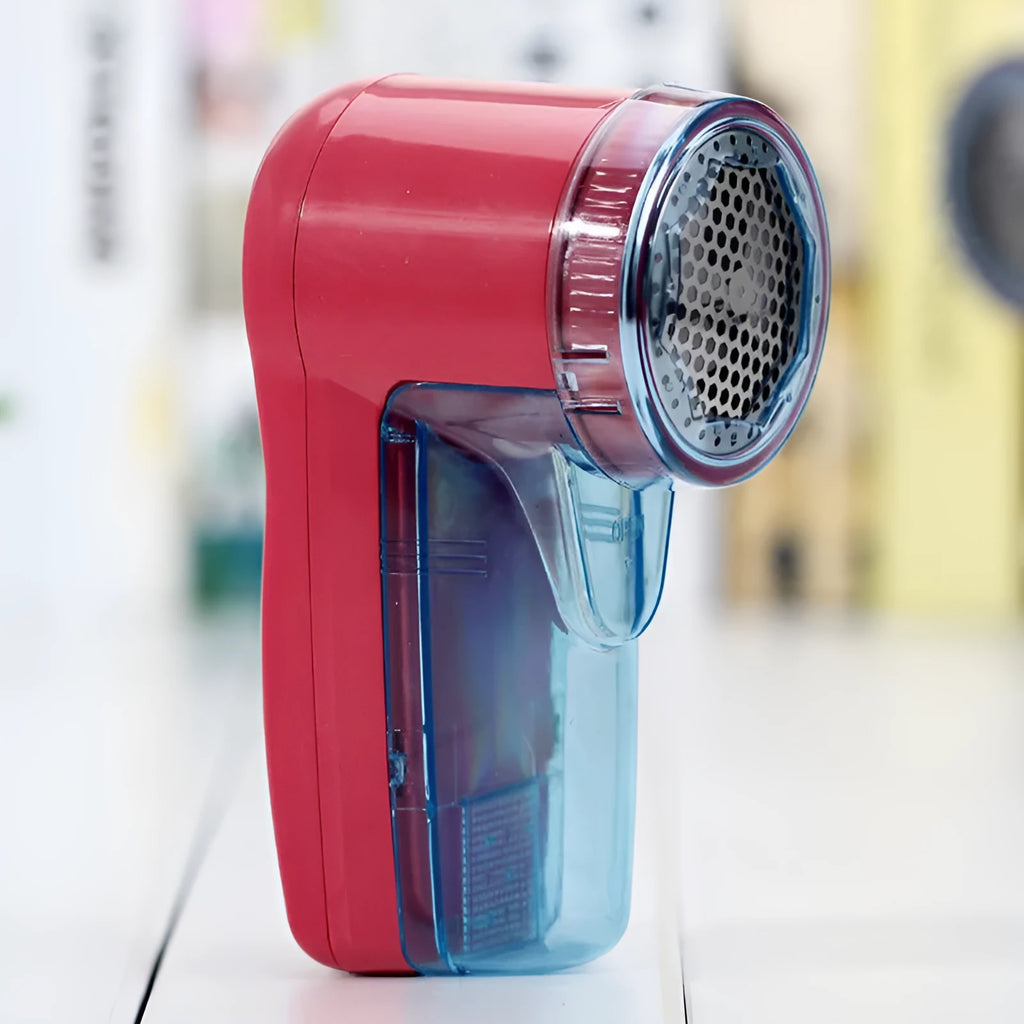 Portable electric lint remover device for removing pills from clothing and sweaters