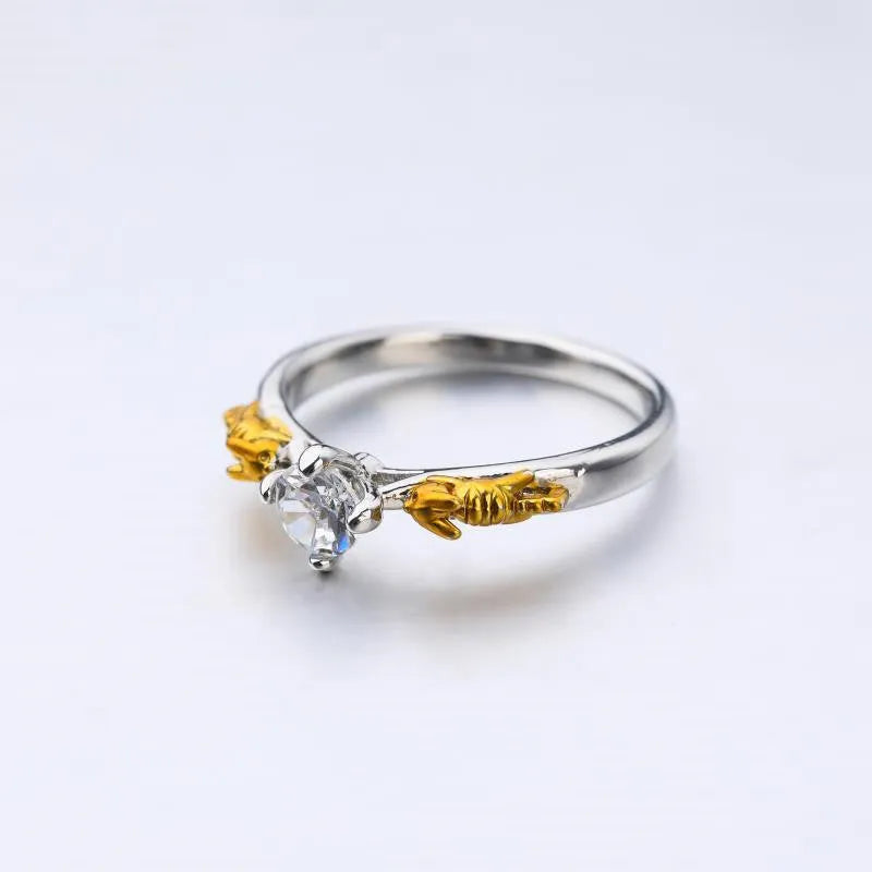 Copper crown fashion ring with black gold finish on a hand.