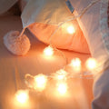 Battery-operated Christmas curtain garland string light with transparent wire, plastic stars and fur balls for window decoration