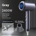 Black household anion hair dryer with blue light, five fan speeds, and air collecting nozzle on neutral background