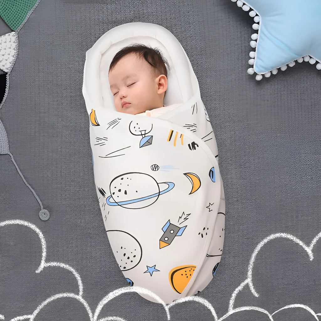 Cotton anti startle baby swaddle in a choice of colours including dinosaur and starry sky patterns.