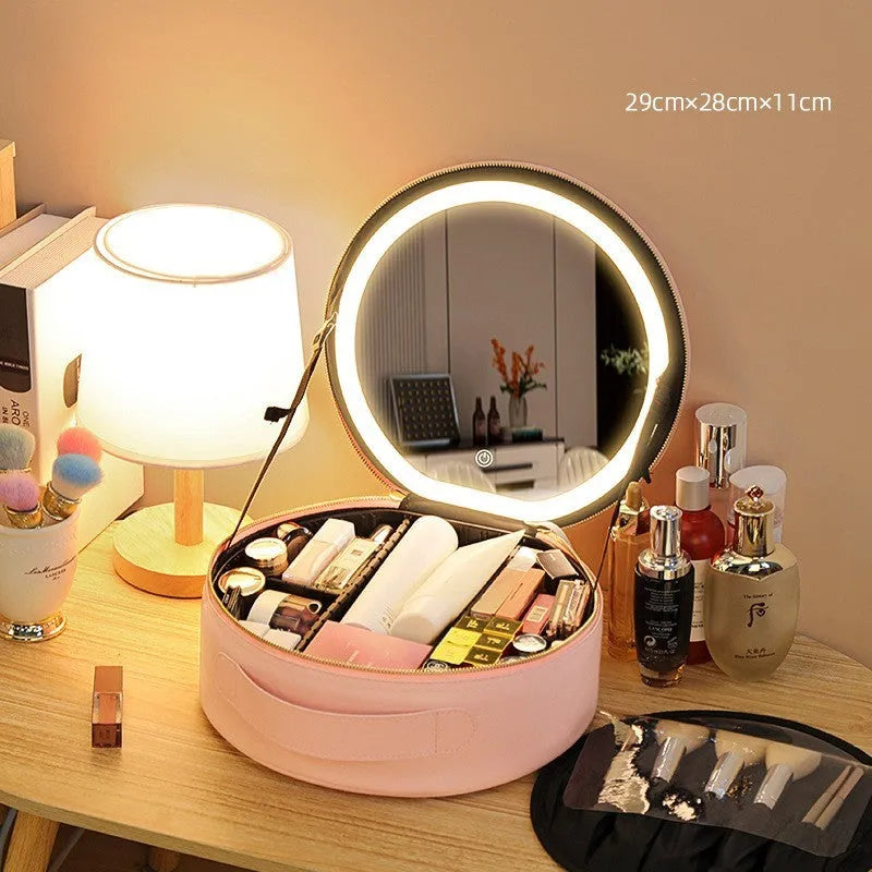 Round black PU leather makeup bag with open lid showing internal LED mirror and cosmetic partitions.