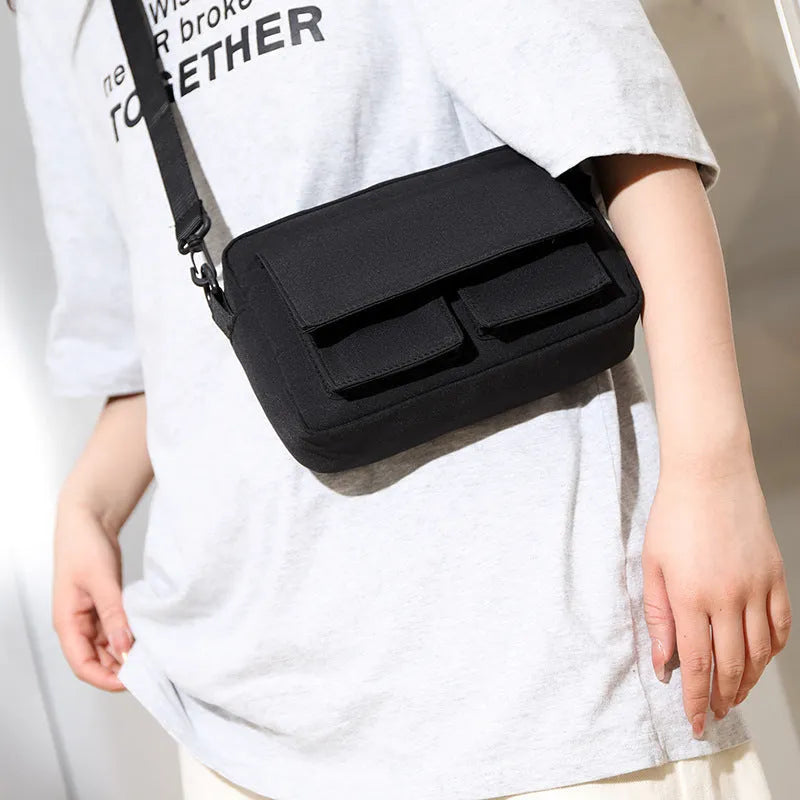 Men's lightweight nylon shoulder bag in black with messenger style for student travel and business use
