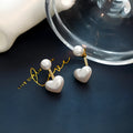 Women's heart-shaped pearl stud earrings with electroplated alloy construction and artificial gemstone details