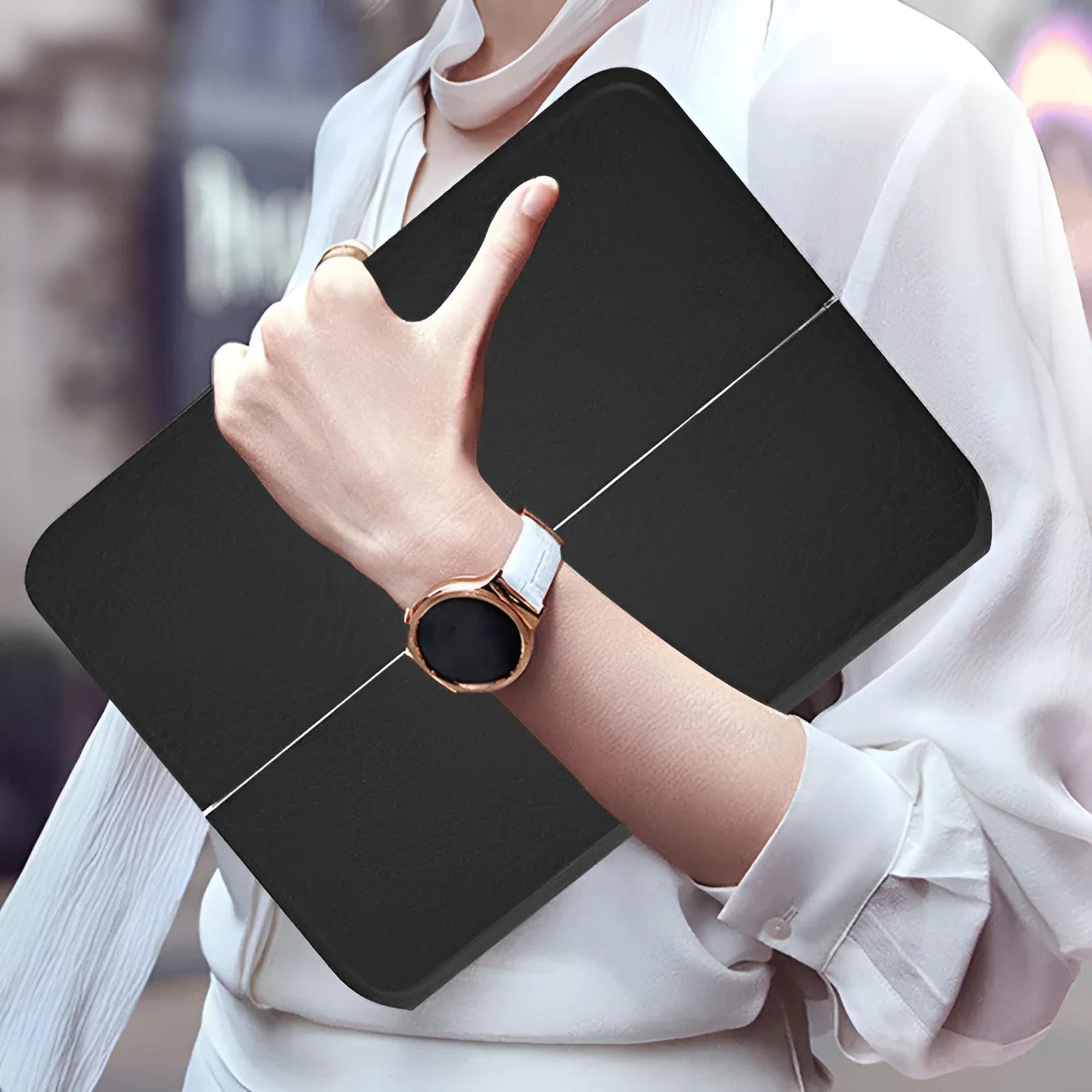 Black ultra-thin flip-style Bluetooth keyboard case open, showing keyboard and iPad slot.