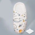 Cotton anti startle baby swaddle in a choice of colours including dinosaur and starry sky patterns.