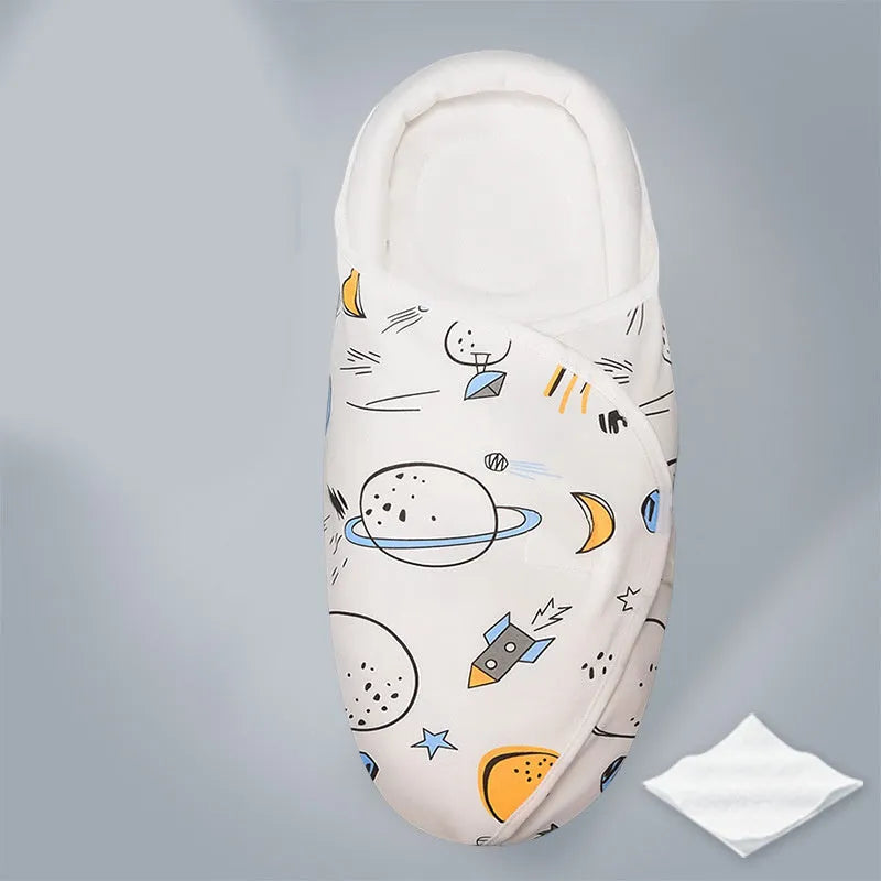 Cotton anti startle baby swaddle in a choice of colours including dinosaur and starry sky patterns.