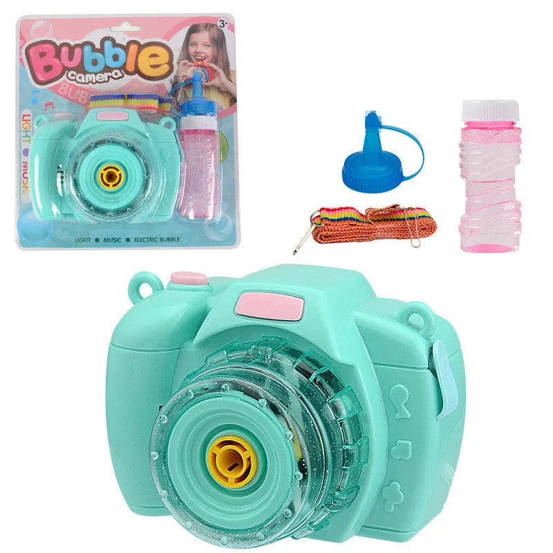 Yellow automatic camera-shaped bubble blower toy for children with flashing lights on a green lawn.