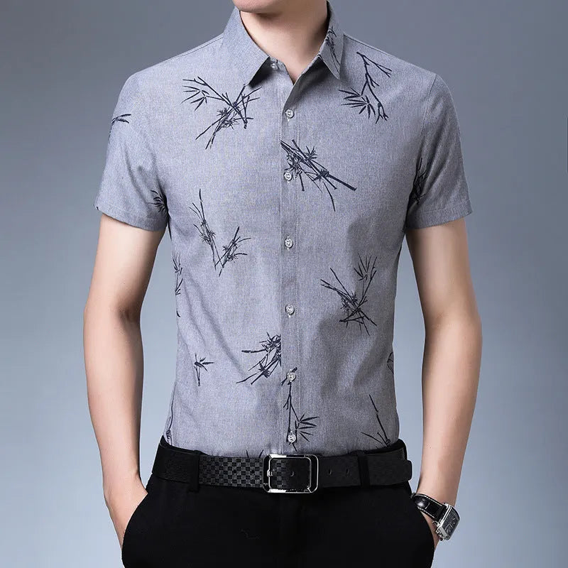 Men's printed slim fit short-sleeve shirt with pointed collar in blue – polyester blend no-iron fabric