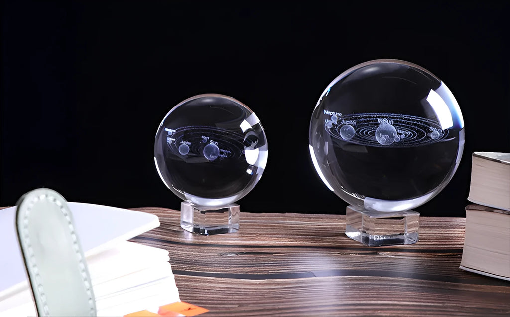 3D engraved solar system inside a clear K9 crystal ball on a gold base, 80mm diameter