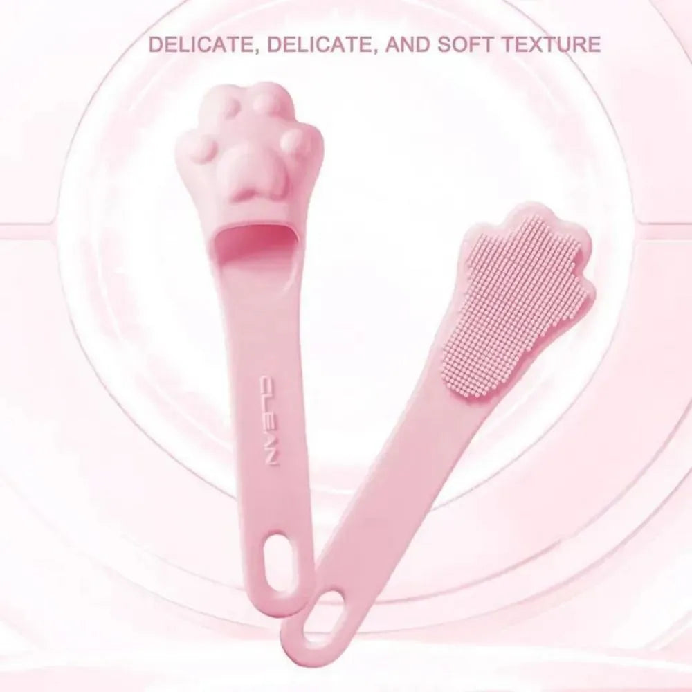 Pink silicone finger toothbrush for dogs and cats with soft nubby bristles.