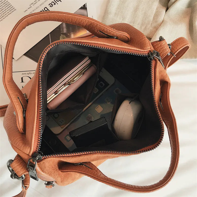 Soft black PU women's casual shoulder tote bag with zipper closure.