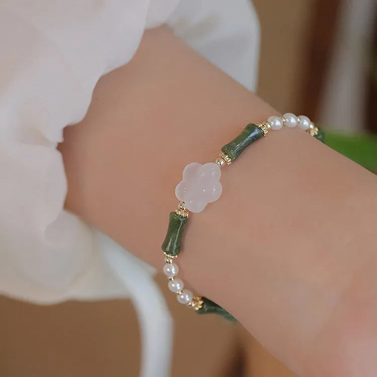 Chinese style women's bracelet with Hetian jade, bamboo joint design, and 4mm shell pearl components