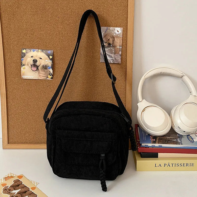 Corduroy crossbody shoulder bag in black with ribbon pendant, horizontal square shape