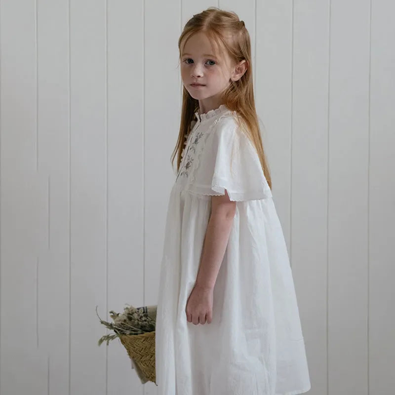 Girls white cotton summer dress with short ruffled sleeves and embroidered skirt detail