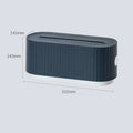 Blue and white plastic cable management box for power strips with lid open showing phone slot and cable holes