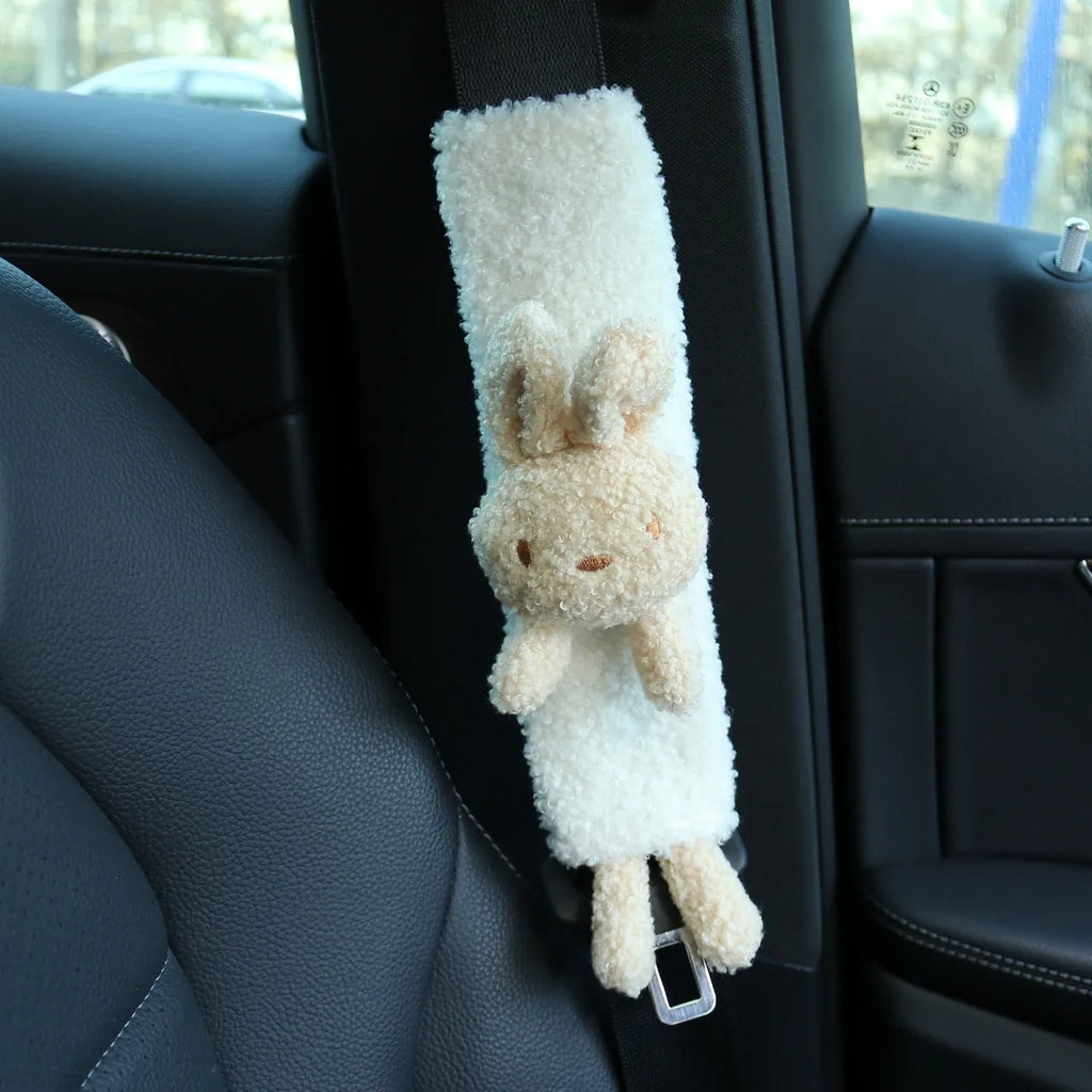 Cartoon plush lamb wool car seat belt shoulder protector in bear and rabbit designs.