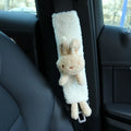 Cartoon plush lamb wool car seat belt shoulder protector in bear and rabbit designs.