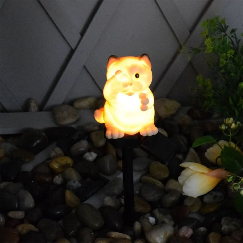 Brown cat-shaped solar-powered lawn light for garden decoration.