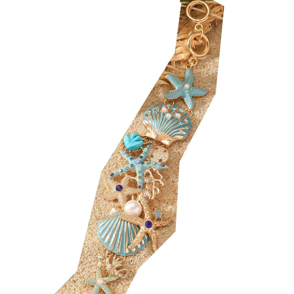 Women's alloy rhinestone bracelet with marine anchor, shell, star, and starfish motifs in blue, red, or turquoise.