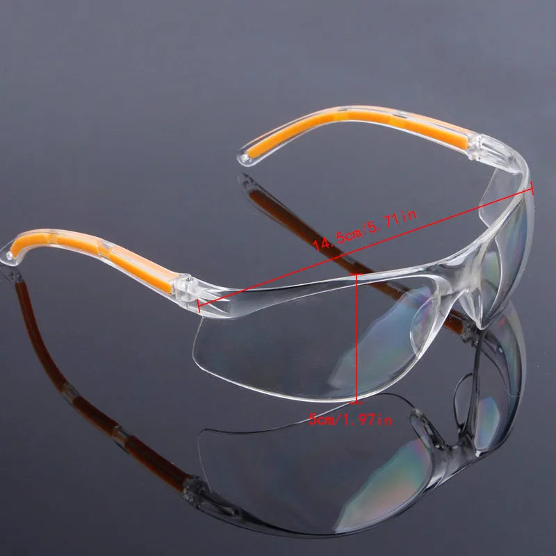 Transparent polycarbonate safety goggles with yellow lenses for eye protection.