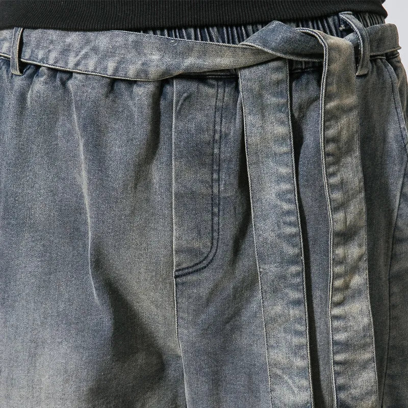 Punk stretch bike denim jeans in solid colour with elastic waist and patches