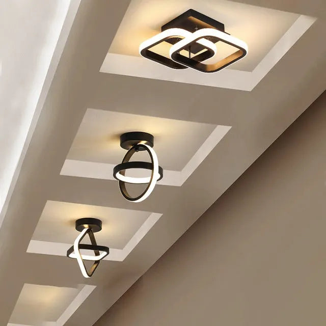 Modern round ceiling light with black finish and white acrylic shade, 21cm diameter.