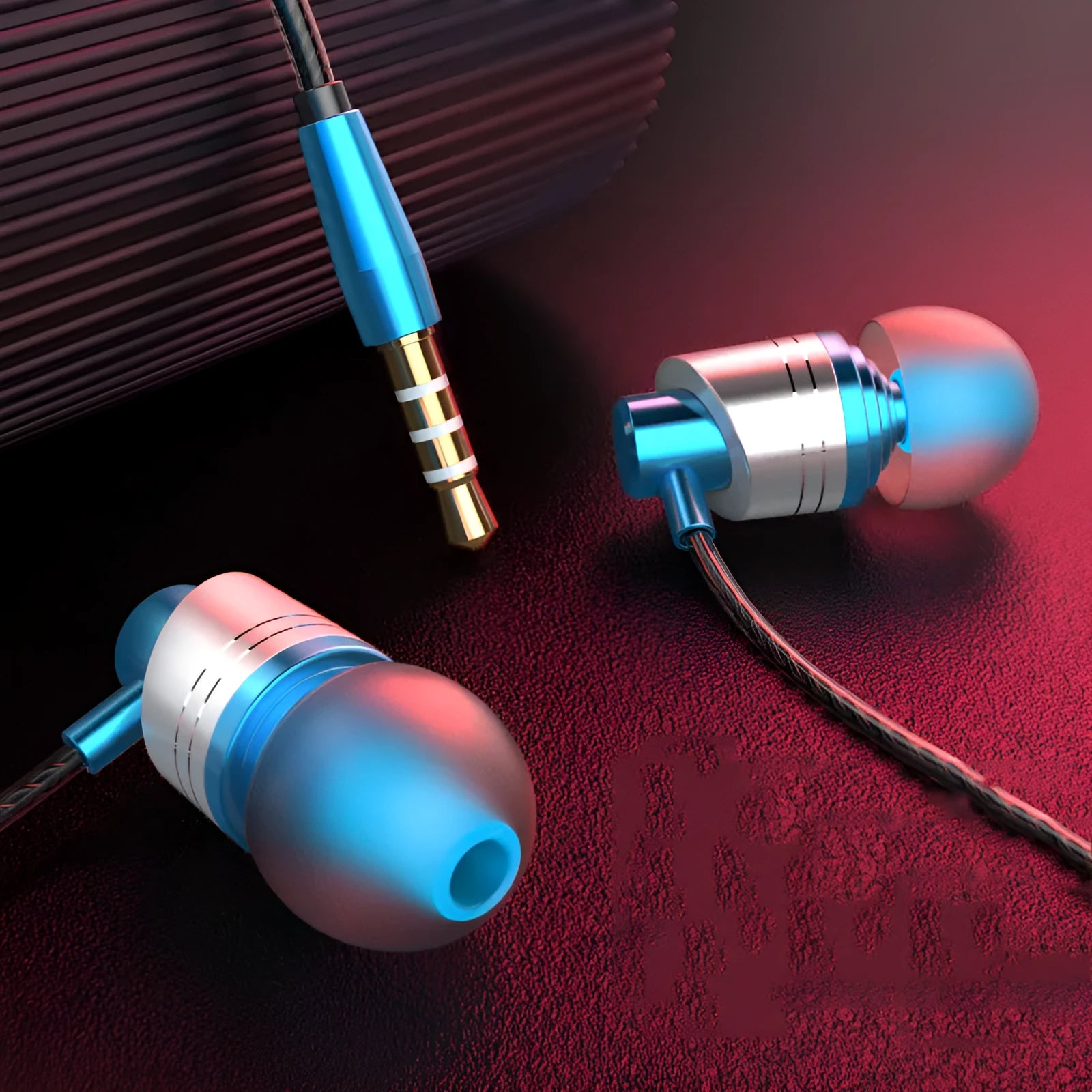 Black wired in-ear headphones with microphone on cable and silicone eartips next to a 3.5mm plug.