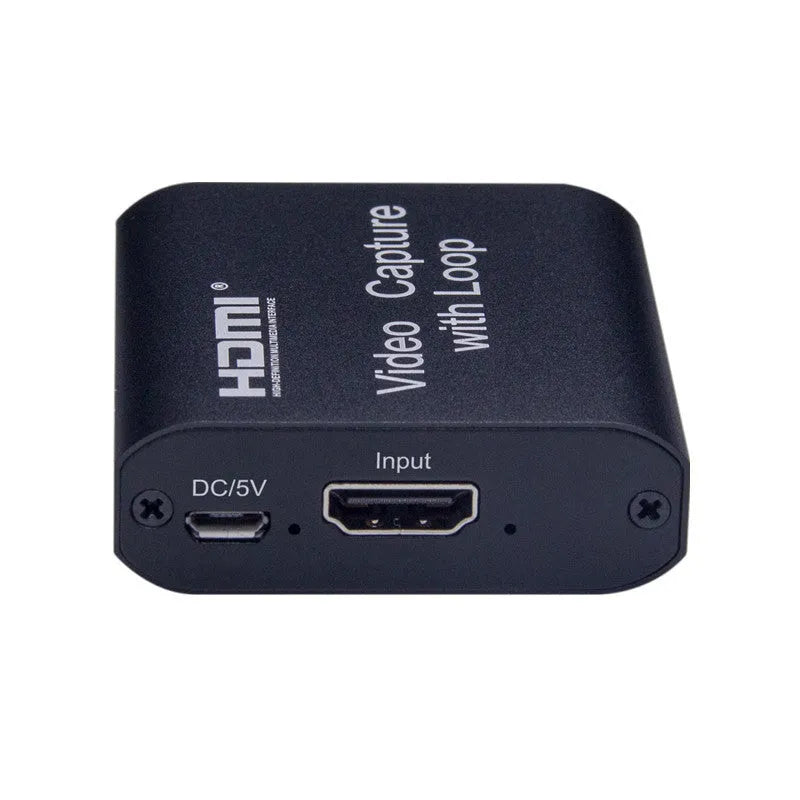 Black HDMI 4K video capture card with loop out and USB interface for computer or smartphone.
