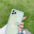 Green soft rubber TPU iPhone case with geometric pattern and smiley face polka dot frame design.
