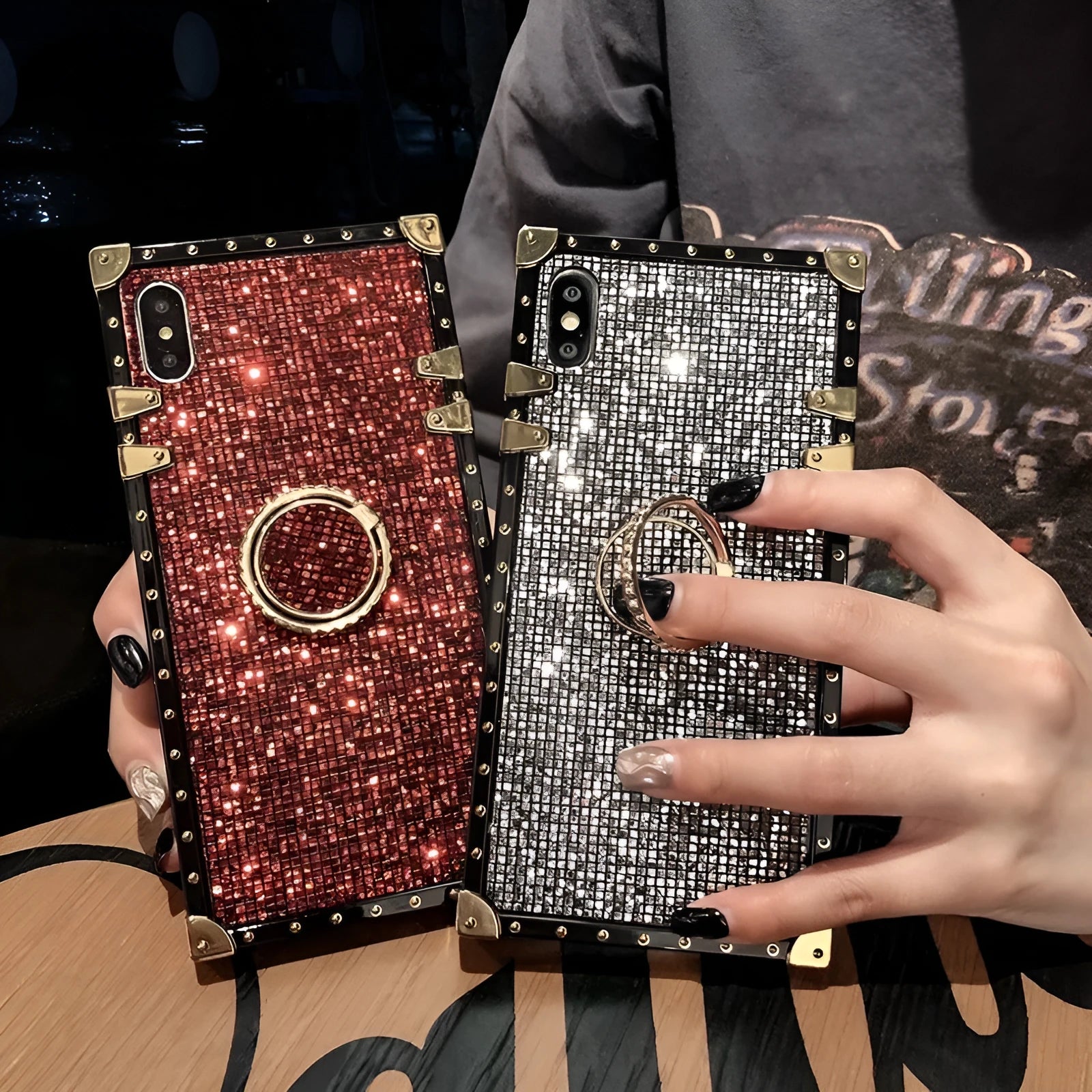 Square clear TPU mobile phone case with a silver flash diamond bracket on a smartphone.