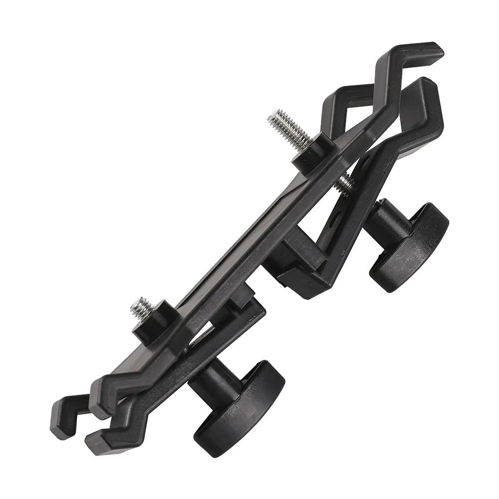 Black ABS plastic umbrella clip for mounting on a camera tripod quick release plate.