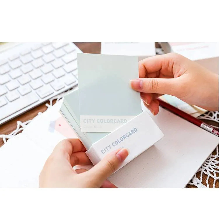 Set of rectangular 75x95mm paper memo notes with creative city colour designs in an OPP bag.