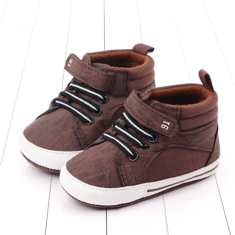 Blue high-top cotton toddler shoes for boys with a Velcro strap fastening.