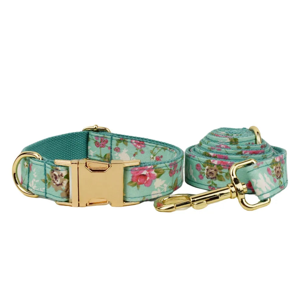 Rose pattern fabric dog collar set with green background including collar, leash, and detachable bow