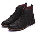 Men's black leather motorcycle boots with buckle details on a rubber sole.