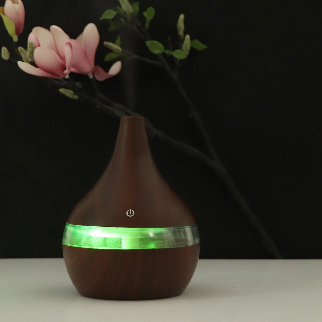 USB-powered mini air purifier humidifier in a wood grain columnar design for small rooms.