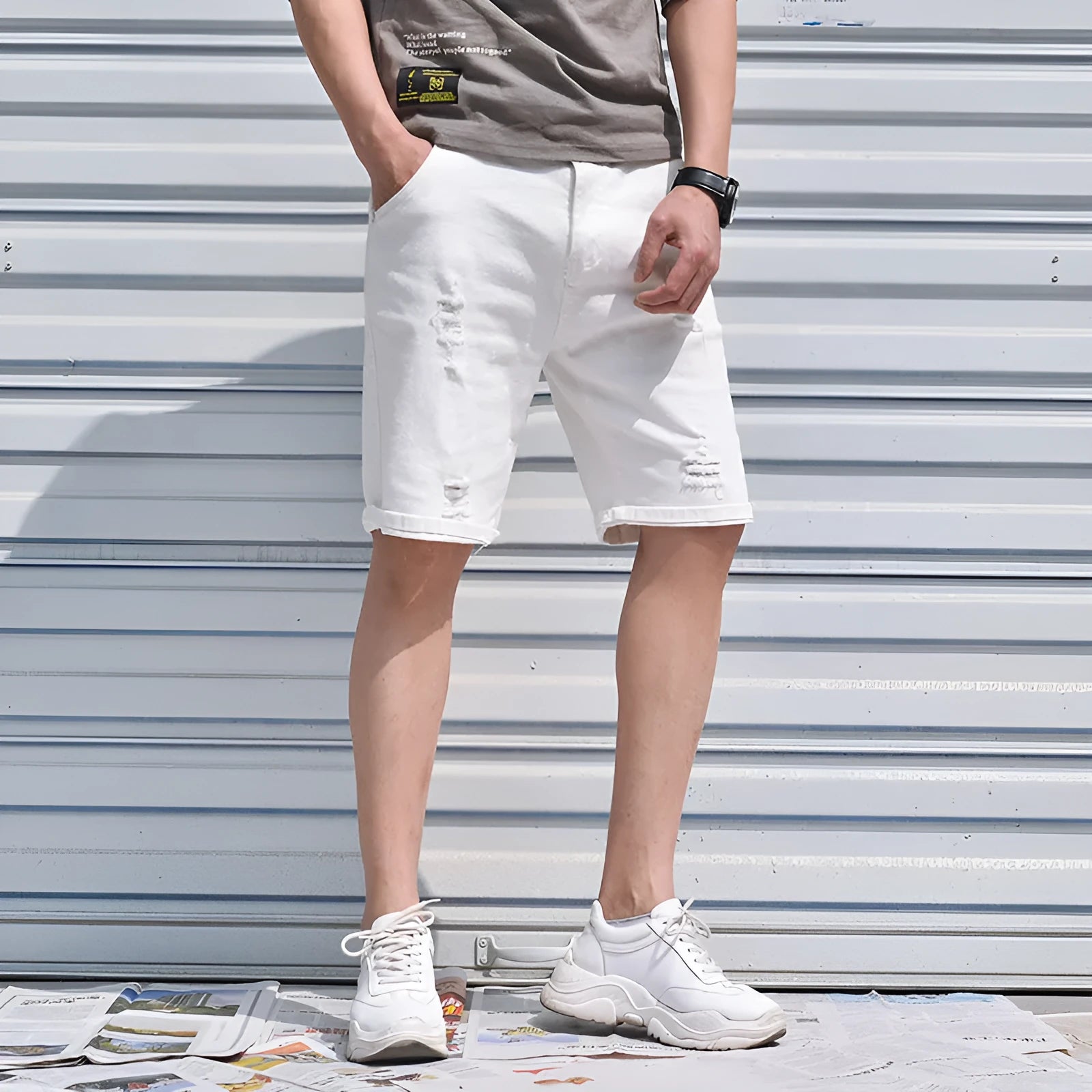 Men's cotton denim shorts in black with loose straight-leg cut and mid-waist zipper closure