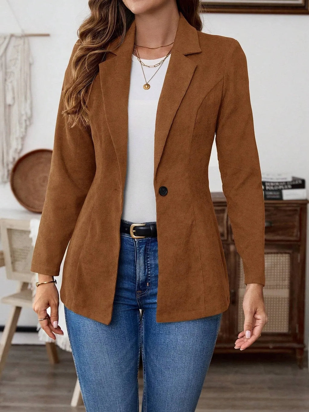 Brown single-breasted men's suit blazer with notch lapels on hanger