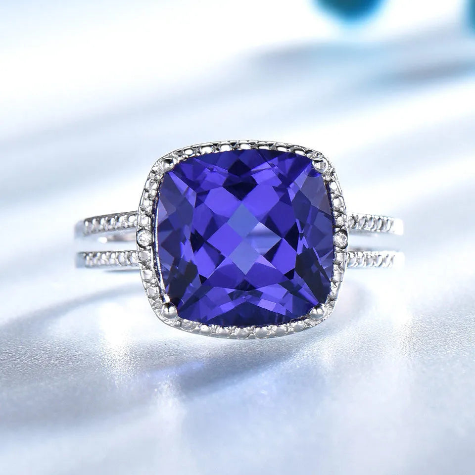 Blue Tanzanite gemstone set in a polished sterling silver women's ring.