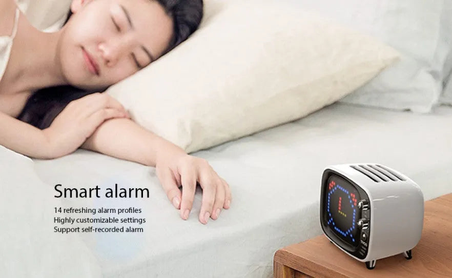 Portable Bluetooth speaker with alarm clock functions in black, blue, green, pink, red, or white colours