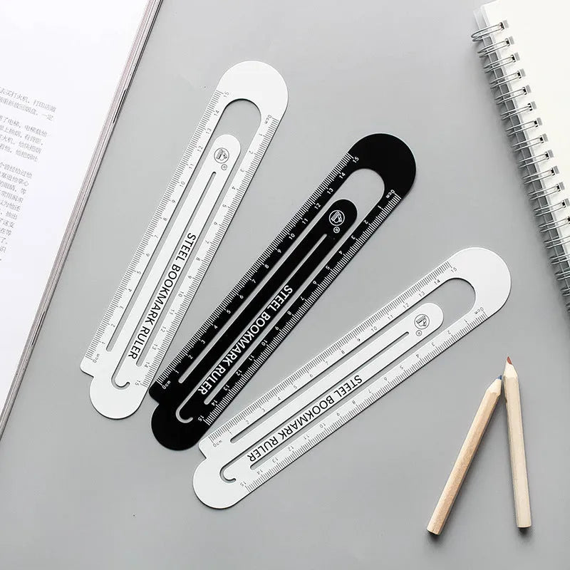 Black and white two-sided metal ruler showing 12cm measurement scales.