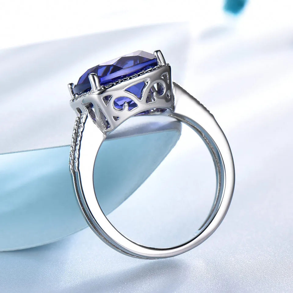 Blue Tanzanite gemstone set in a polished sterling silver women's ring.