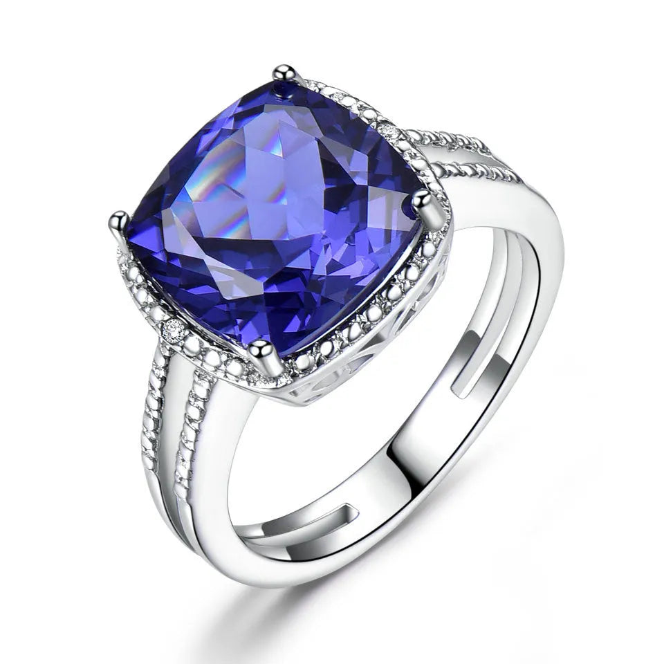 Blue Tanzanite gemstone set in a polished sterling silver women's ring.