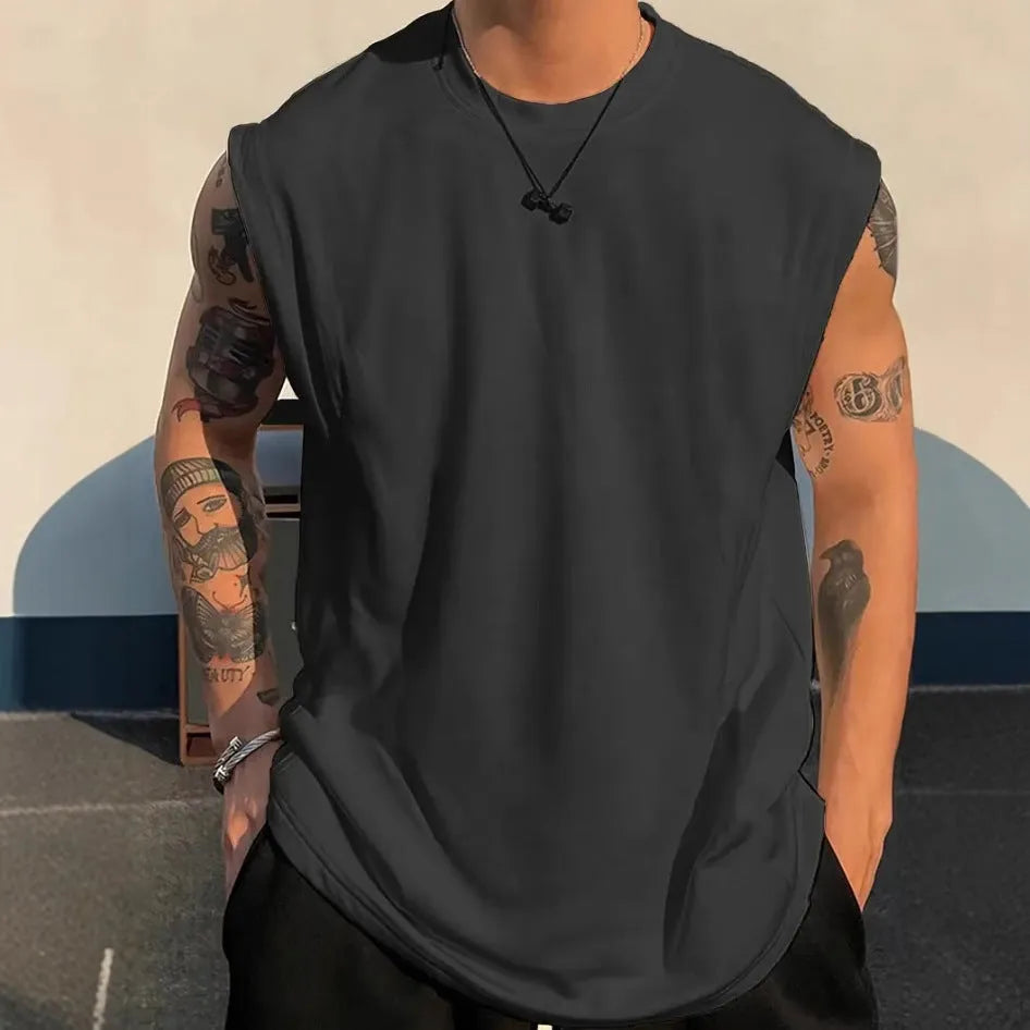 Men's loose apricot-coloured cotton tank top on a hanger.