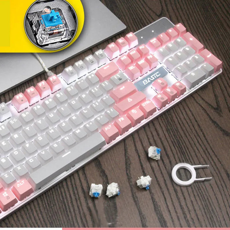 Girly pink coloured 104-key wired mechanical keyboard on a desk
