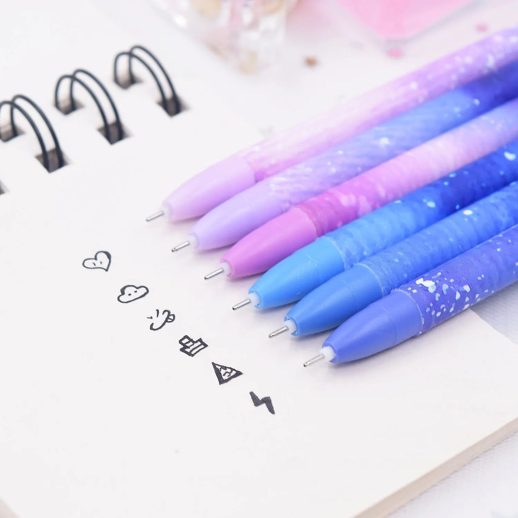Boxed set of 12 constellation-themed quick-drying gel pens with plastic barrels.